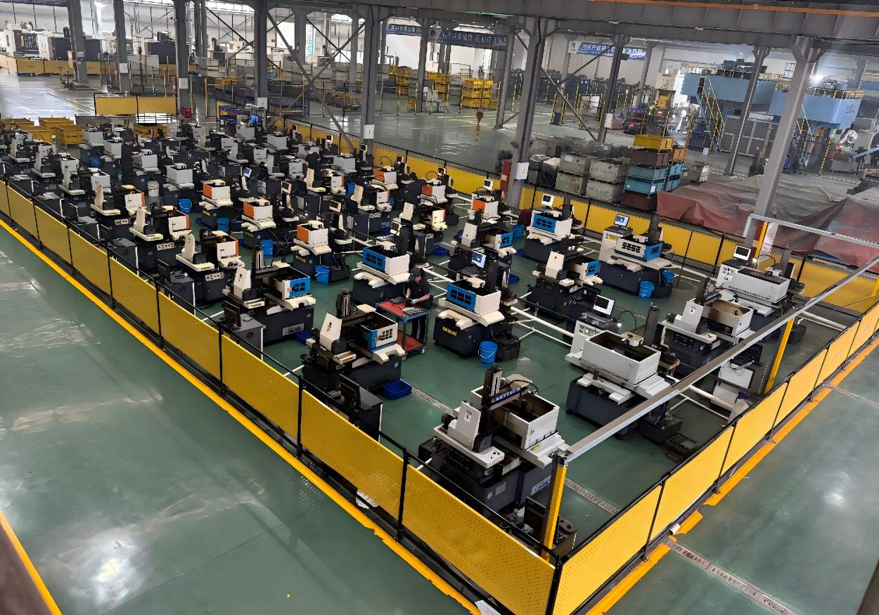 Interior view of Rilon's modern manufacturing facility featuring rows of precision CNC machines for high-volume metal part production.