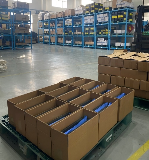 Precision metal components neatly sorted in protective trays for final quality inspection at Rilon.